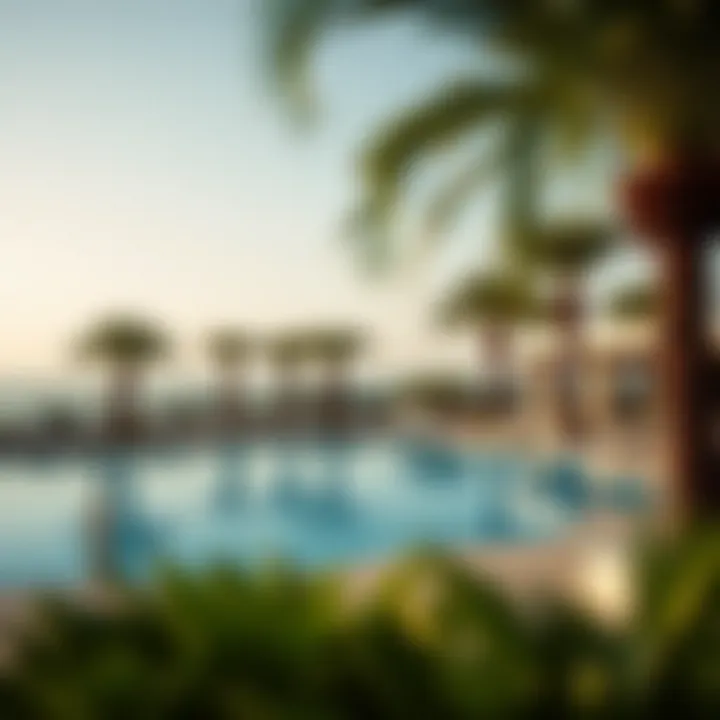 Luxurious swimming pool area at Barcelo Residences with sun loungers and palm trees