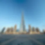 Majestic Ground View of Burj Al Sharq A panoramic view of Burj Al Sharq from the ground, showcasing its grandeur against a clear sky.