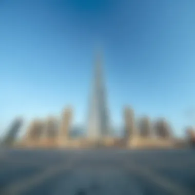 Majestic Ground View of Burj Al Sharq A panoramic view of Burj Al Sharq from the ground, showcasing its grandeur against a clear sky.