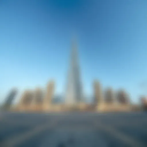 Majestic Ground View of Burj Al Sharq A panoramic view of Burj Al Sharq from the ground, showcasing its grandeur against a clear sky.