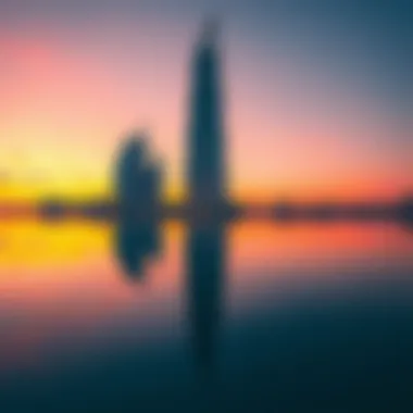 Enchanting Sunset Reflection on Burj Al Sharq A sunset view over Burj Al Sharq, illustrating the enchanting colors reflected on its surface.
