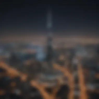 Night view of Burj Al Jazeera illuminated against the Dubai skyline