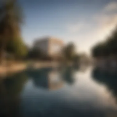 Lakeside View of Tilal Al Ghaf A serene lakeside view reflecting the architectural beauty of Tilal Al Ghaf