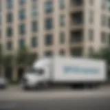 A professional moving truck parked outside a residential building